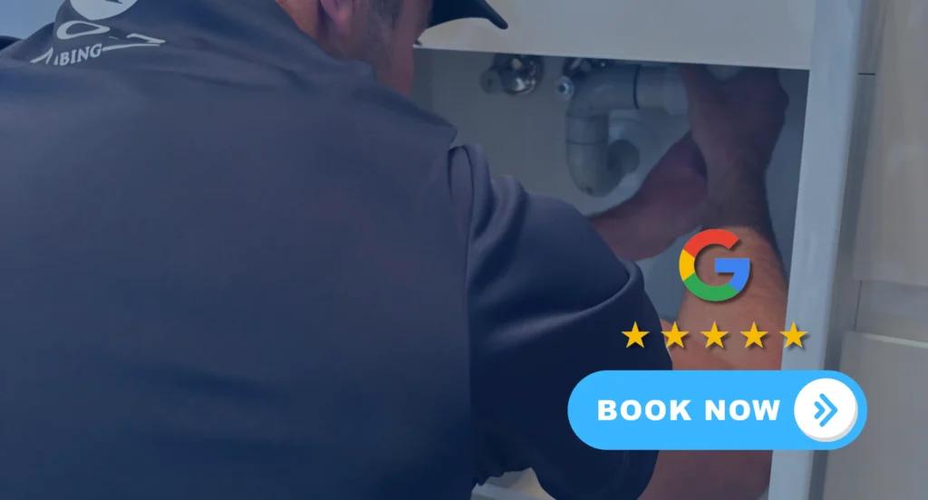 plumber installing hot water system